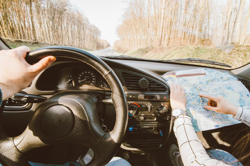 couple riding car by highway. car travel concept