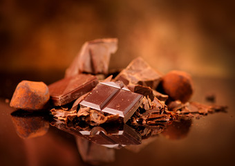 Chocolate. Assorted chocolate sweets and candies over dark background. Confectionery
