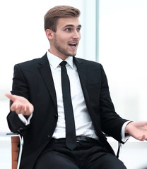 closeup . businessman talking while sitting in a chair.