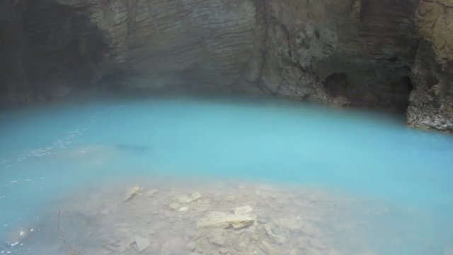 Natural underground karst mineral lake Proval with pure blue water in Pyatigorsk.