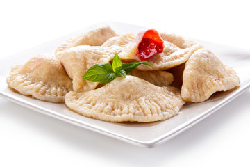 Dumplings - stuffed noodles on white background