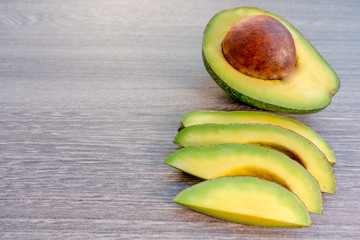 Avocado on a brown wood background.
