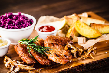 Grilled steak with baked potatoes and vegetables