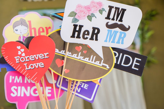 Photo booth props colors text design, Props for photos on weddings featuring cute and funny phrases.