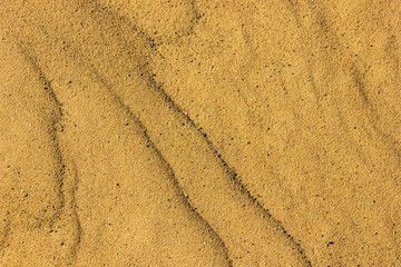 Fototapeta na wymiar Texture of river or sea sand, close-up