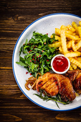 Grilled beefsteak with french fries and vegetable salad