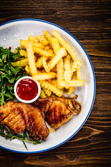Grilled beefsteak with french fries and vegetable salad