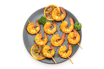 Grilled tiger shrimps skewers with lemon