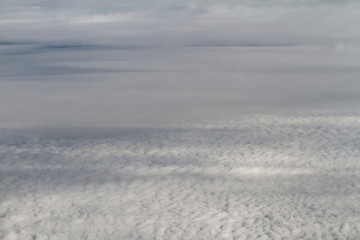 Sunrise above clouds from airplane window