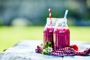 Bright strawberry smoothies summer picnic table