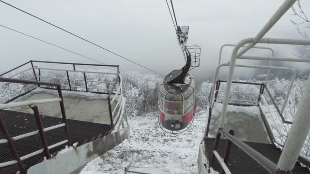 The cable car cabin is very slowly approaching the upper station.