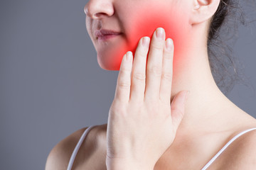 Woman with toothache, teeth pain closeup
