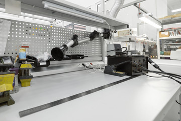 Workplace for the assembly of industrial electronic modules.