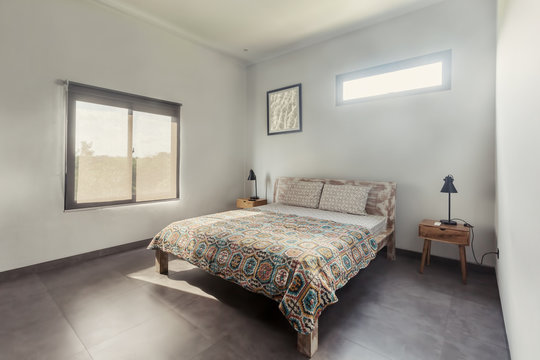 Natural bedroom interior, wooden bed, white walls,  minimalism
