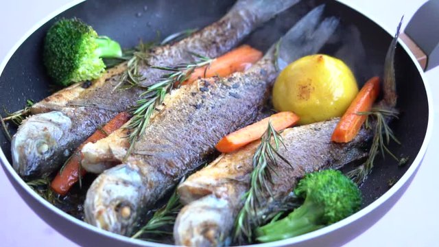 Frying Dorade Fish On A Pan 