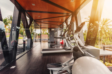 Small gym in Luxury villa, big windows, tropical view