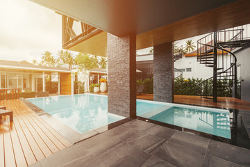 Private swimming pool near luxury villa. Sunny summer travel vacation