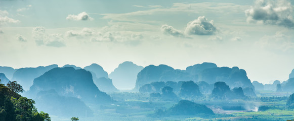 Amazing view from Wat Tham Seua (Tiger Cave Temple), Krabi province, Thailand. Beautiful silhouettes of mountains - Powered by Adobe