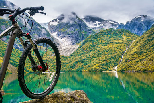 Mountain bike on the background on amazing Norway landscape. Artistic picture. Beauty world.