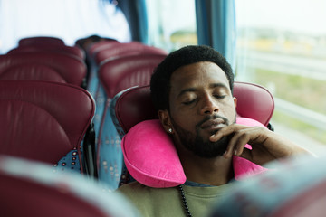 Portrait of man sleeping in touristic bus