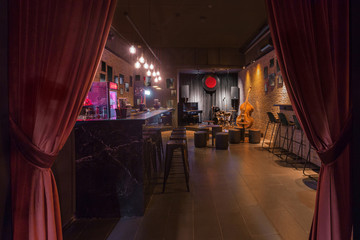 Modern jazz bar interior design, stage with black piano and cello, lamps above bar counter - obrazy, fototapety, plakaty