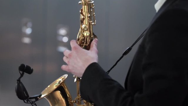 Man playing music on golden saxophone