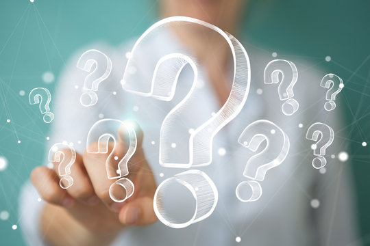 Businesswoman touching and holding hand drawn question marks