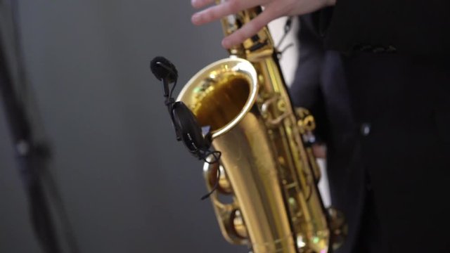 Man playing music on golden saxophone