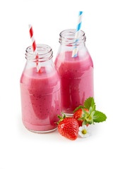 Two freshly blended strawberry smoothies