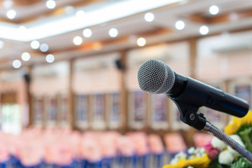 Seminar Conference Concept : Microphones for speech or speaking in seminar room, talking for lecture to audience international meeting, Event light convention hall Background.