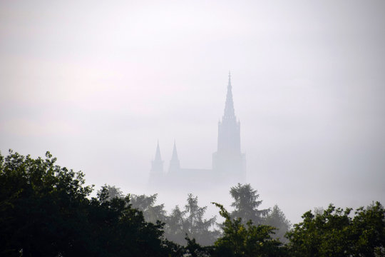 cathedral of ulm shrouded in the deep fog
