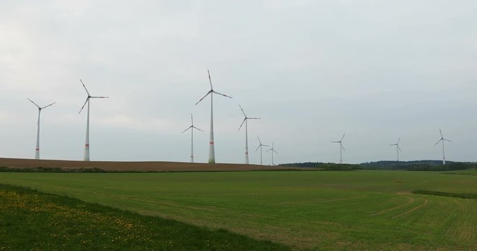 renewable energy: power generating wind turbines in the countryside