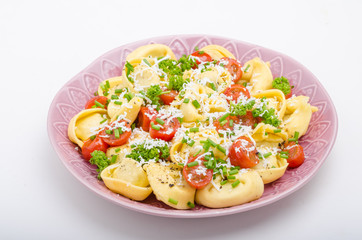 Filled tortellini with herbs, tomatoes