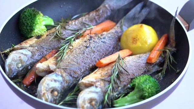 Frying Dorade Fish On A Pan 