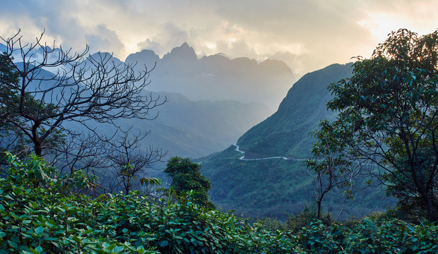View of the mountain serpentine from the pass Tram Ton, in the north of Vietnam, near the mountain village of Sapa. - Powered by Adobe