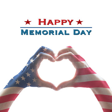 Happy memorial day with America flag pattern on people hands in heart shape isolated on white background