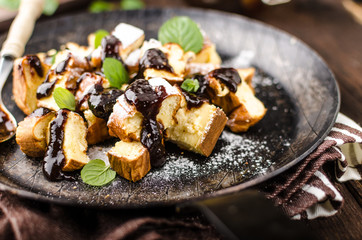 Cutted pancakes, Kaiserschmarrn delish dessert with plums