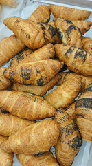 freshly baked tasty bread and rolls on the display. Croissant