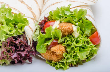 Grilled tortilla with chicken, mayo and tomato ketchu....Grilled tortilla chicken, lettuce, homemade mayo and barbeque sauce