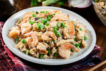 Fried rice with shrimp and vegetables served on a plate