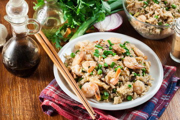 Fried rice with shrimp and vegetables served on a plate