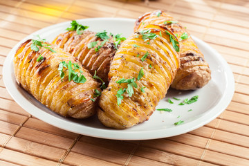 Baked potatoes with cheese and herbs