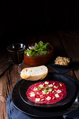 Carpaccio of beef with pine nuts, colorful pepper and Parmesan cheese