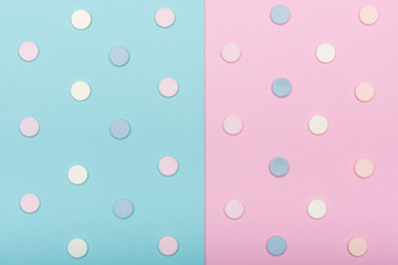 Assortment of various colourful pills isolated on blue pastel coloured background. Medication and prescription pills flat lay background.