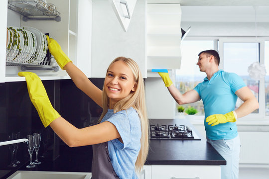 House Cleaning. A Young Couple Is Cleaning An Apartment.