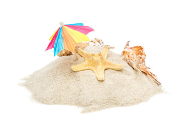 Fototapeta na wymiar Beach umbrella with seashells on heap of sand. Isolated on white.