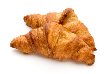 Tasty buttery croissants on the white background.