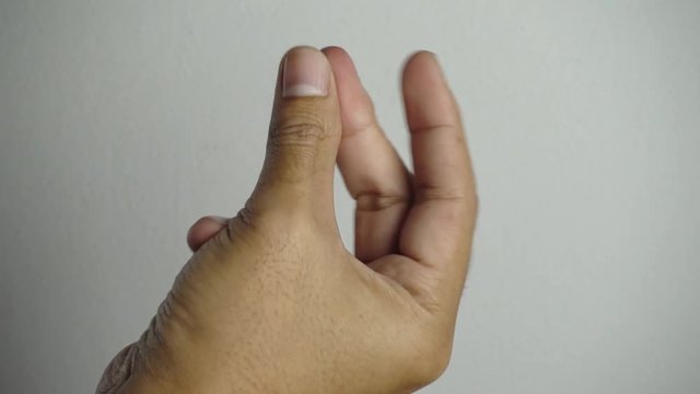 Snapping fingers man's hand. 4K Resolution.
