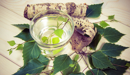 A glass of birch juice on wooden background - 206686012