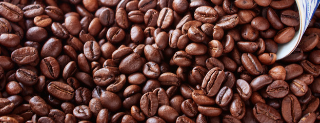 Coffee cup from thin porcelain against the background   grains.